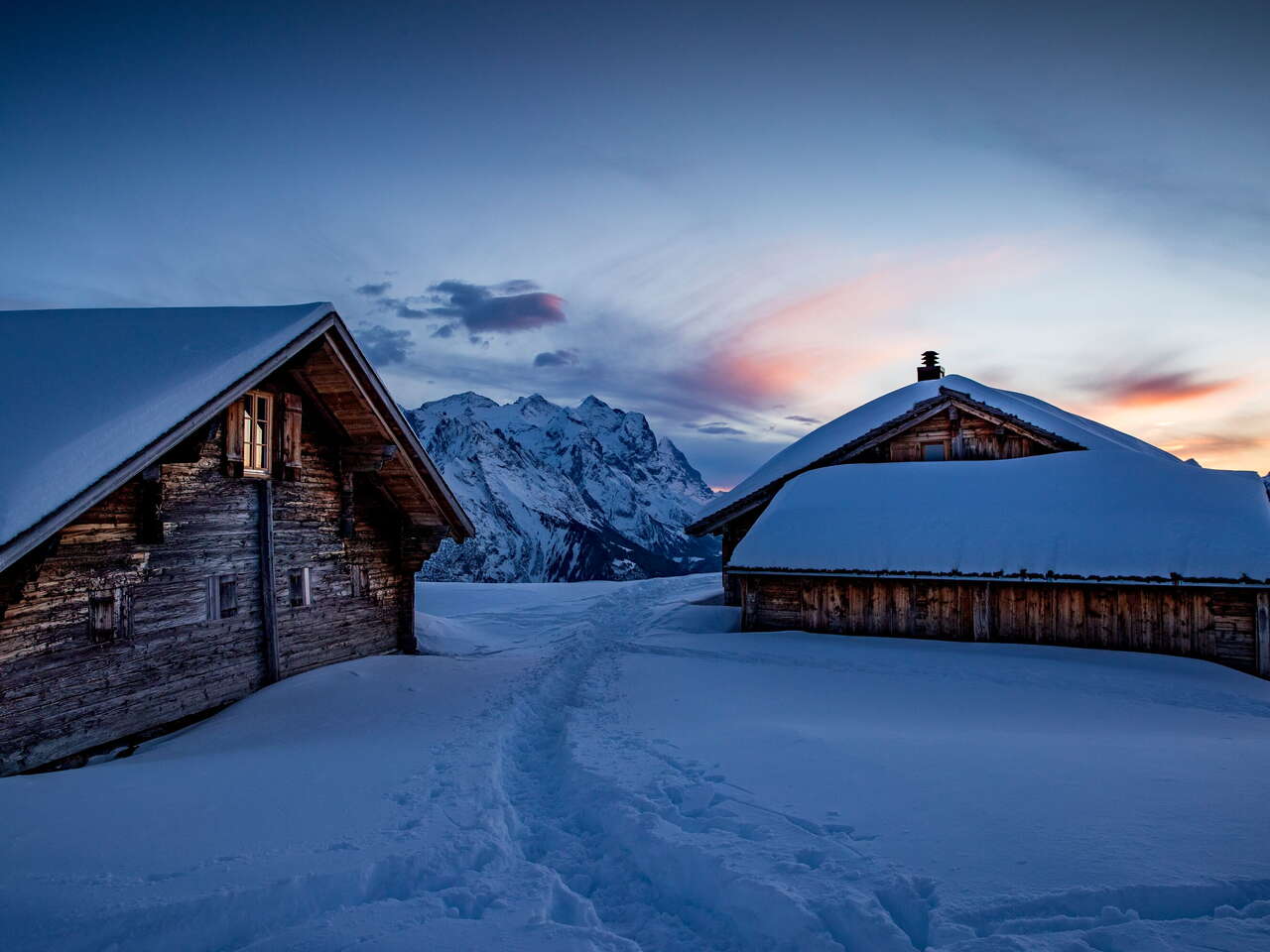 Evening atmosphere: Snow-covered huts on the Hasliberg